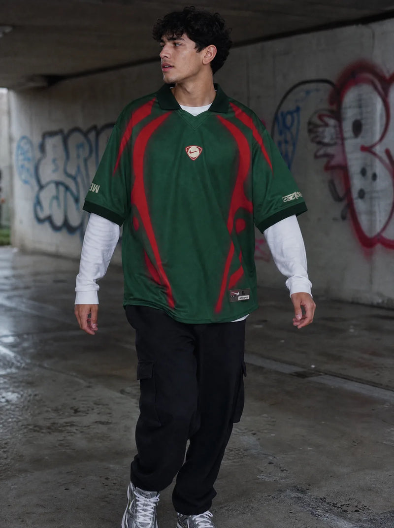 Cactus Jack × Total 90 — groen en rood shirt